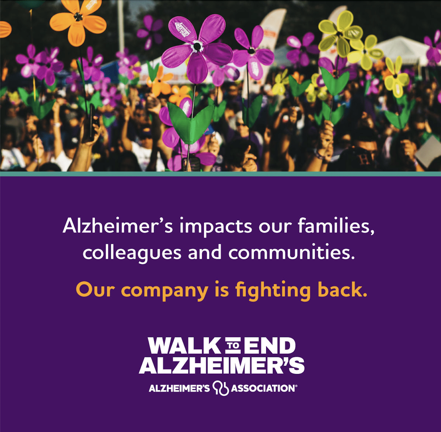 A large group of people hold colorful pinwheel flowers representing support for Alzheimer’s awareness during the Walk to End Alzheimer’s event.
