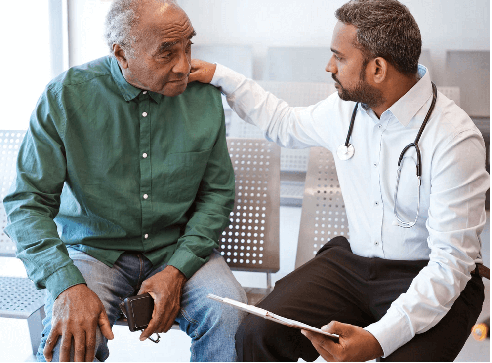 Patient satisfaction in healthcare. Doctor consulting with senior male patient in clinic